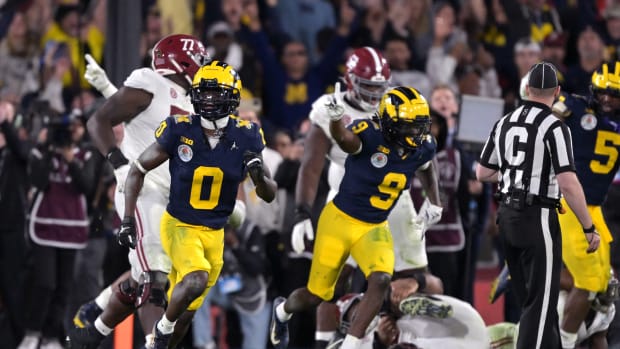 Jan 1, 2024; Pasadena, CA, USA; Michigan Wolverines defensive back Mike Sainristil (0) and defensive back Rod Moore (9) celebrate after defeating the Alabama Crimson Tide in the 2024 Rose Bowl college football playoff semifinal game at Rose Bowl.