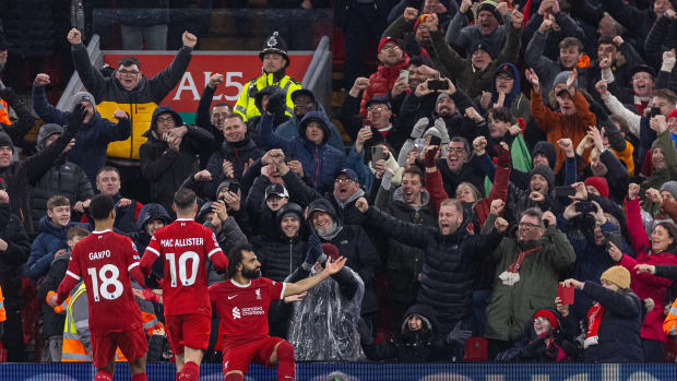 Liverpool's players and supporters pictured celebrating during a 4-2 win over Newcastle in the Premier League in January 2024