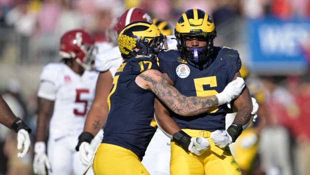 Michigan Wolverines defensive end Josaiah Stewart (5) is congratulated by defensive end Braiden McGregor (17) after a sack against the Alabama Crimson Tide during the first half in the 2024 Rose Bowl college football playoff semifinal game at Rose Bowl.