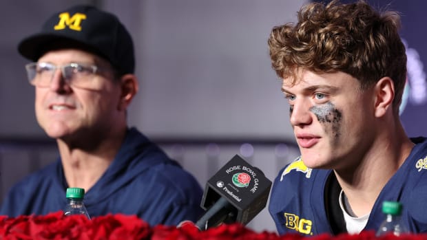Michigan Wolverines head coach Jim Harbaugh and quarterback J.J. McCarthy (9) speak in a press conference after defeating the Alabama Crimson Tide in the 2024 Rose Bowl college football playoff semifinal game at Rose Bowl.
