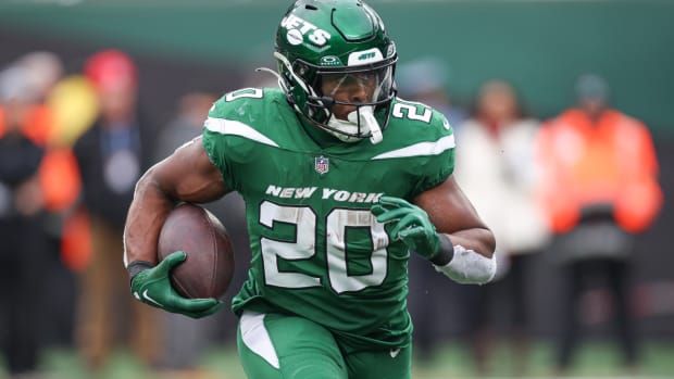 Dec 24, 2023; East Rutherford, New Jersey, USA; New York Jets running back Breece Hall (20) carries the ball during the first half against the Washington Commanders at MetLife Stadium. Mandatory Credit: Vincent Carchietta-USA TODAY Sports  