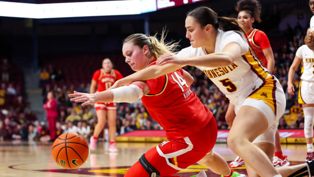 Maryland's Allie Kubek and Minnesota's Maggie Czinano battle for the ball