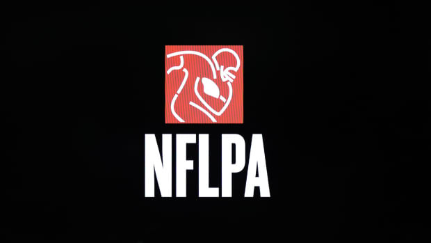 Feb 1, 2018; Bloomington, MN, USA; A detailed view of NFLPA logo during a press conference in advance of Super Bowl LII between the New England Patriots and Philadelphia Eagles at Mall of America.