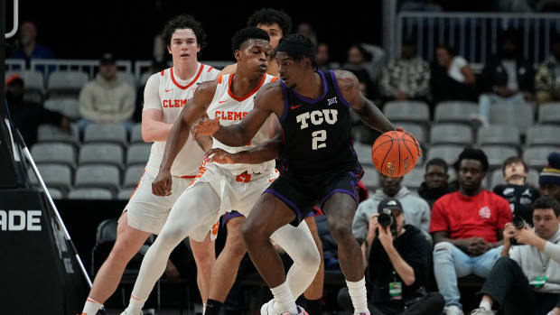 Dec 9, 2023; Toronto, Ontario, CAN; TCU Horned Frogs forward Emanuel Miller (2) drives against Clemson Tigers forward RJ Godfrey (10) during the second half at Coca-Cola Coliseum.