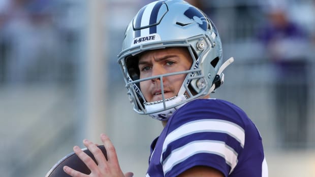 Kansas State quarterback Will Howard prepares to throw a pass in warmups before a game.