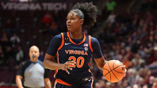 Camryn Taylor dribbles the ball during the Virginia women's basketball game at Virginia Tech.