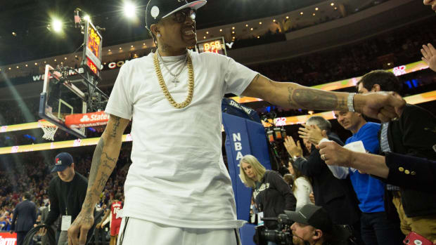 NBA Hall of Fame member and former Philadelphia 76ers Allen Iverson cheers on with fans in game two of the first round of the 2018 NBA Playoffs against the Miami Heat at Wells Fargo Center.