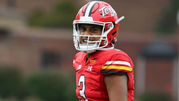 Maryland quarterback Taulia Tagovailoa smiles while playing in a game.