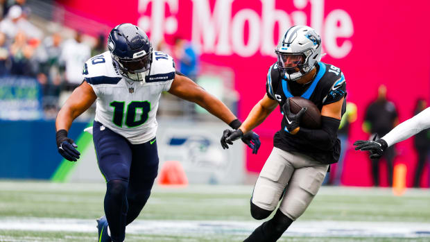 Nwosu and Panthers wide receiver Adam Thielen during the Seahawks' 37-27 win over Carolina on Sept. 24, 2023.