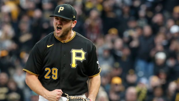Apr 7, 2023; Pittsburgh, Pennsylvania, USA; Pittsburgh Pirates relief pitcher Wil Crowe (29) seats after recording the final out against the Chicago White Sox during the ninth inning at PNC Park. The Pirates won 13-9.