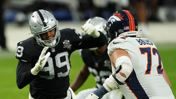 Las Vegas Raiders defensive end Arden Key (99) is defended by Denver Broncos offensive tackle Garett Bolles (72) in the fourth quarter at Allegiant Stadium. The Raiders defeated the Broncos 37-12.