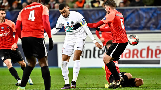 Kylian Mbappe pictured (center) playing for Paris Saint-Germain against US Revel in the Coupe de France in January 2024
