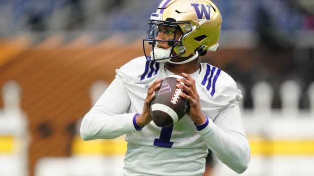 Jan 6, 2024; Houston, TX, USA; Washington Huskies quarterback Michael Penix Jr. (9) passes the ball during a practice session before the College Football Playoff national championship game against the Michigan Wolverines at NRG Stadium. Mandatory Credit: Kirby Lee-USA TODAY Sports