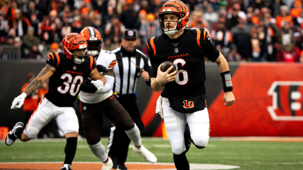 Cincinnati Bengals quarterback Jake Browning (6) runs for a first down in the second quarter of the NFL game between Cincinnati Bengals and Cleveland Browns at Paycor Stadium in Cincinnati on Sunday, Jan. 7, 2024.
