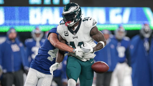 Jan 7, 2024; East Rutherford, New Jersey, USA; New York Giants cornerback Nick McCloud (44) forced a fumble by Philadelphia Eagles wide receiver A.J. Brown (11) during the first quarter at MetLife Stadium.