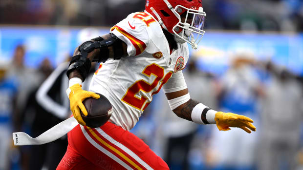 Jan 7, 2024; Inglewood, California, USA; Kansas City Chiefs safety Mike Edwards (21) returns a fumble for a touchdown during the first half against the Los Angeles Chargers at SoFi Stadium. Mandatory Credit: Orlando Ramirez-USA TODAY Sports  