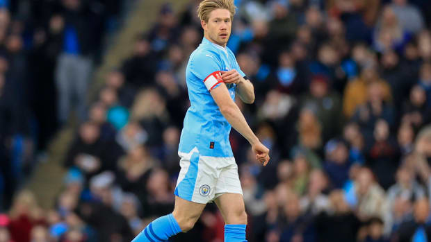 Kevin De Bruyne pictured adjusting his captain's armband during Manchester City's 5-0 win over Huddersfield Town in the FA Cup in January 2024