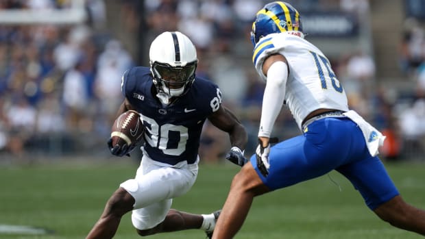 Sep 9, 2023; University Park, Pennsylvania, USA; Penn State Nittany Lions wide receiver Cristian Driver (80) runs with the ball while trying to avoid a tackle during the fourth quarter against the Delaware Fightin' Blue Hens at Beaver Stadium. Penn State defeated Delaware 63-7.