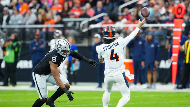 Las Vegas Raiders defensive end Tyree Wilson (9) pressures Denver Broncos quarterback Jarrett Stidham (4) during the first quarter at Allegiant Stadium.