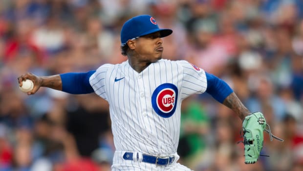Jul 31, 2023; Chicago, Illinois, USA; Chicago Cubs starting pitcher Marcus Stroman (0) pitches during the first inning against the Cincinnati Reds at Wrigley Field.
