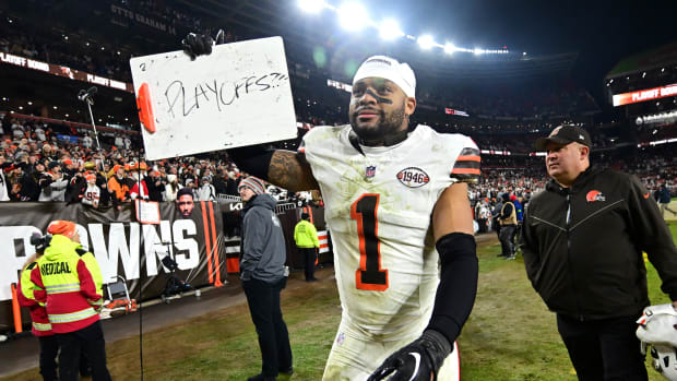 Cleveland Browns safety Juan Thornhill (1) hold a sign referencing the NFL playoffs after defeating the New York Jets at Cleveland Browns Stadium.