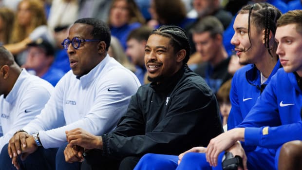 Dec 31, 2022; Lexington, Kentucky, USA; Former Kentucky Wildcats player Tyler Ulis sits on the bench during the game against the Louisville Cardinals at Rupp Arena at Central Bank Center. Ulis joined the coaching staff as a student assistant. Mandatory Credit: Jordan Prather-USA TODAY Sports  