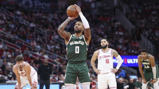 Milwaukee Bucks guard Damian Lillard (0) attempts a free throw during the second quarter against the Houston Rockets 