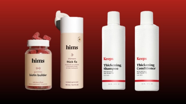 A bottle of hims biotin builder gummies, hims thick fix shampoo, Keeps Thickening Shampoo and Keeps Thickening Conditioner against a red background.