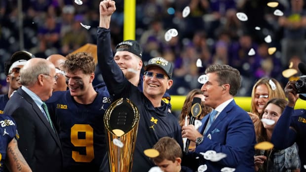 Jan 8, 2024; Houston, TX, USA; Michigan Wolverines wide receiver Cornelius Johnson (6) and head coach Jim Harbaugh celebrate after beating the Washington Huskies in the 2024 College Football Playoff national championship game at NRG Stadium. Mandatory Credit: Kirby Lee-USA TODAY Sports  