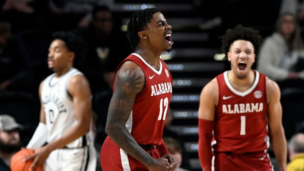 Alabama guard Latrell Wrightsell Jr. (12) celebrates with Mark Sears (1) after Wrightsell Jr. made a 3-point basket against Vanderbilt guard Tyrin Lawrence (0) during the first half of an NCAA college basketball game Saturday, Jan. 6, 2024, in Nashville, Tenn.