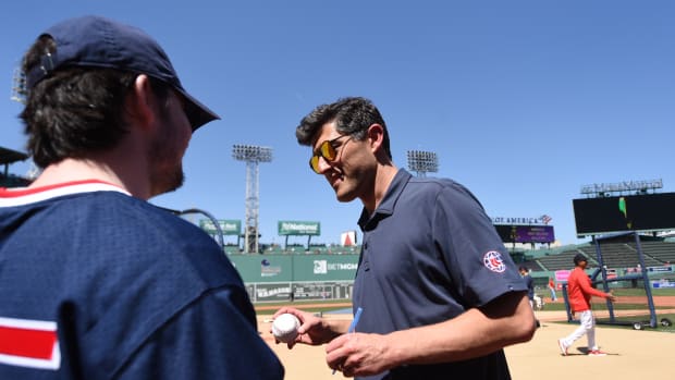 May 16, 2023; Boston, Massachusetts, USA; Boston Red Sox chief baseball officer Chaim Bloom signs an autograph prior to a game against the against the St. Louis Cardinals at Fenway Park.