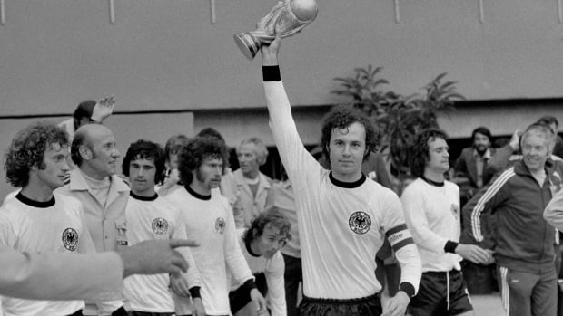 Germany captain Franz Beckenbauer pictured lifting the World Cup trophy in 1974