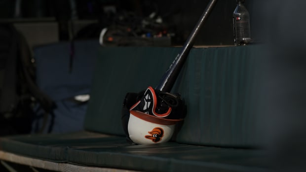 May 17, 2023; Baltimore, Maryland, USA; A Baltimore Orioles batting helmet sits on a bench in the dugout before the game against the Los Angeles Angels at Oriole Park at Camden Yards.