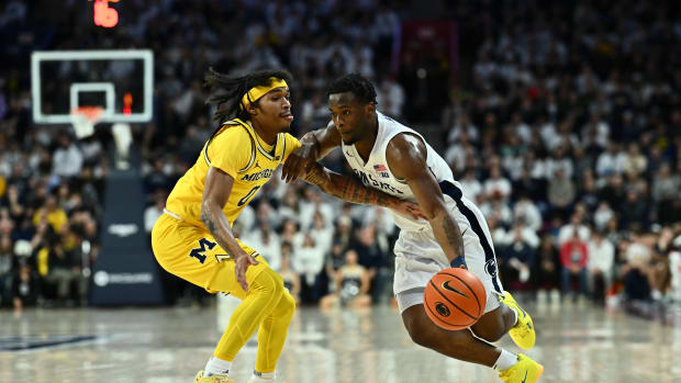 Penn State's Kanye Clary drives the basket against Michigan in a Big Ten college basketball game at the Palestra in Philadelphia.