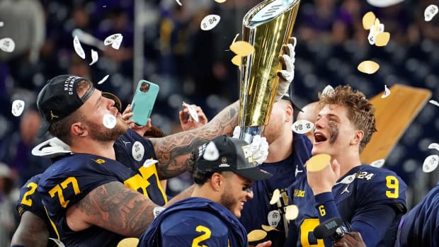 Michigan Wolverines players celebrate their win over the Washington Huskies in the CFP national championship game on Jan. 8, 2024.