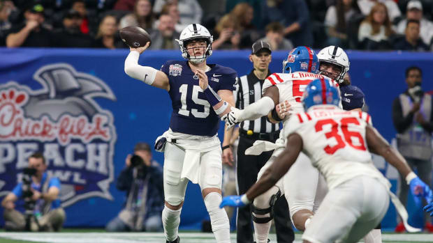 Penn State quarterback Drew Allar attempts a pass against Ole Miss in the 2023 Peach Bowl at Mercedes-Benz Stadium.