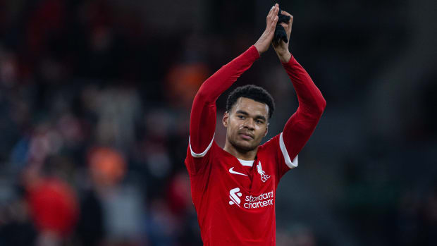 Cody Gakpo pictured applauding Liverpool's home supporters following a 2-1 win over Fulham at Anfield in January 2024