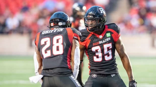 Jun 15, 2023; Ottawa, Ontario, CAN; Ottawa REDBLACKS lineback Frankie Griffin (28) and defensive back Douglas Coleman (35) celebrate a broken play against the Calgary Stampeders in the first half against the at TD Place. Mandatory Credit: Marc DesRosiers-USA TODAY Sports  