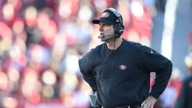 December 28, 2014; Santa Clara, CA, USA; San Francisco 49ers head coach Jim Harbaugh watches from the sideline against the Arizona Cardinals during the second quarter at Levi's Stadium. Mandatory Credit: Kyle Terada-USA TODAY Sports  