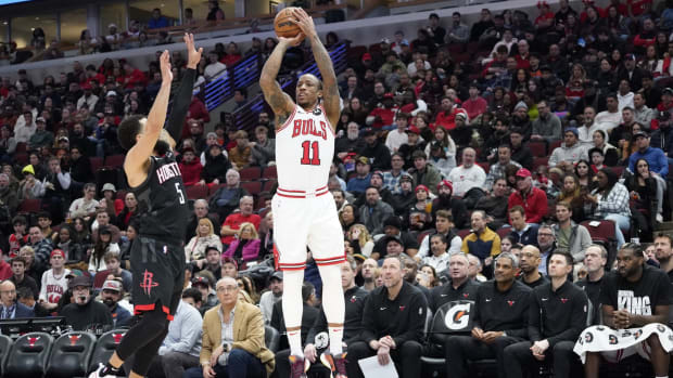 Chicago Bulls forward DeMar DeRozan (11) shoots over Houston Rockets guard Fred VanVleet (5) during the second half at United Center.