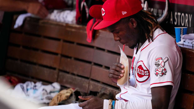 Elly De La Cruz (44) sips a smoothie on the bench in the eighth inning of the MLB Interleague game between the Cincinnati Reds and the Minnesota Twins at Great American Ball Park in downtown Cincinnati on Wednesday, Sept. 20, 2023. 