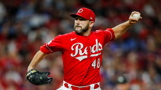 Aug 19, 2023; Cincinnati, Ohio, USA; Cincinnati Reds relief pitcher Alex Young (48) pitches against the Toronto Blue Jays in the ninth inning at Great American Ball Park. Mandatory Credit: Katie Stratman-USA TODAY Sports 