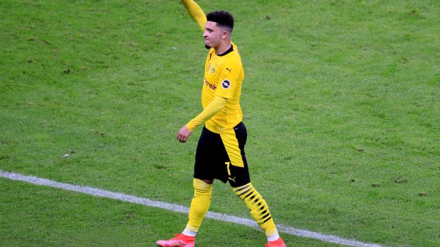 Jadon Sancho pictured celebrating after scoring a goal for Borussia Dortmund in May 2021