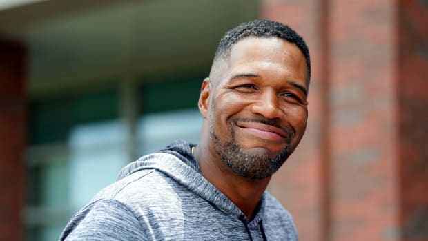 Former New York Giants defensive end Michael Strahan greets reporters after the first day of mandatory minicamp at the Giants training center in East Rutherford on Tuesday, June 13, 2023.