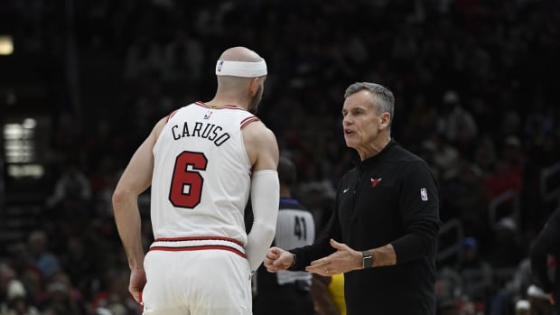 Chicago Bulls guard Alex Caruso (6) talks with Chicago Bulls head coach Billy Donovan during the second half against the Indiana Pacers at United Center.