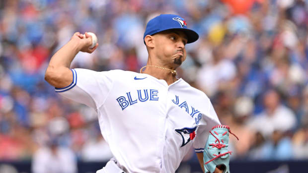 Aug 27, 2023; Toronto, Ontario, CAN; Toronto Blue Jays relief pitcher Jordan Hicks (12) delivers a pitch against the Cleveland Guardians in the seventh inning at Rogers Centre. Mandatory Credit: Dan Hamilton-USA TODAY Sports