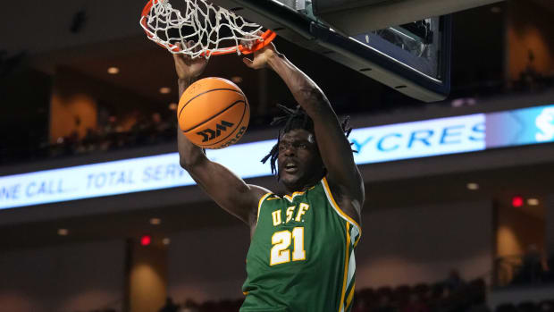 March 4, 2023; Las Vegas, NV, USA; San Francisco Dons forward Ndewedo Newbury (21) dunks the basketball during the second half in the quarterfinals of the WCC Basketball Championships at Orleans Arena