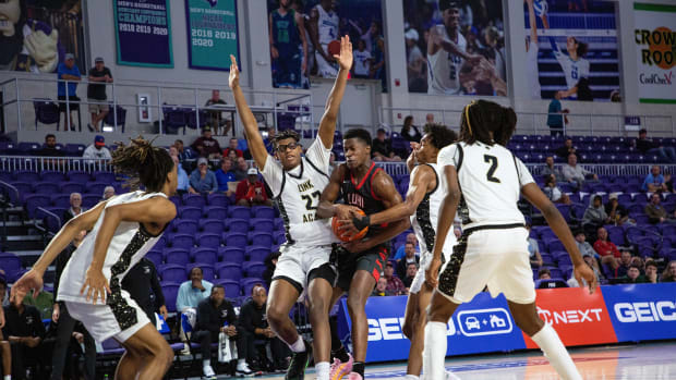 VJ Edgecombe of Long Island Lutheran is surrounded by Link Academy defenders in the second semifinal matchup in the City of Palms Classic on Friday, Dec. 22, 2023 at Suncoast Credit Union Arena in Fort Myers.