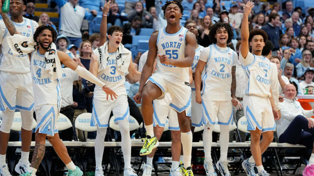 The North Carolina Tar Heels bench celebrates during a game against Syracuse
