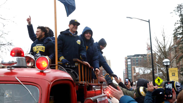 Jim Harbaugh and Michigan players during the 2024 national championship parade in Ann Arbor.